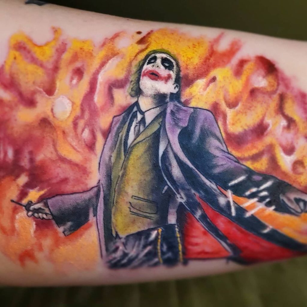 Realistic portrait tattoo of The Joker holding a bat, custom art from Soulful Ink Studios Watford City ND